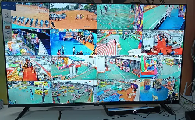 Large monitor showing sixteen CCTV camera feeds at once