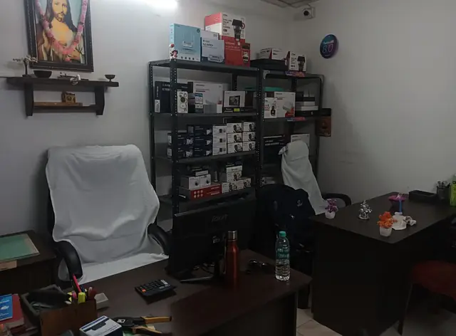 Winzone office desk with product shelves behind it