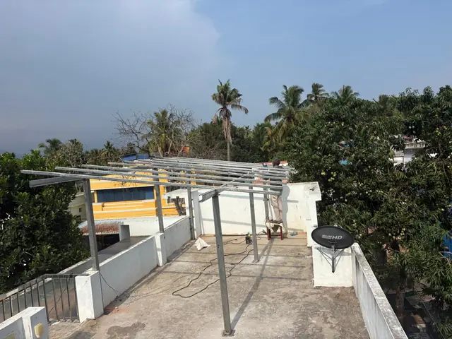 Galvanised solar mounting frame on a flat concrete roof